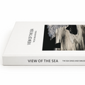 Book titled 'View of the Sea' with a cover featuring a black and white image of a person in water.